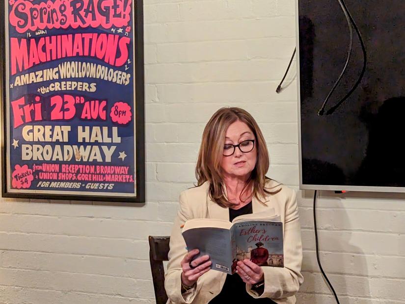 Caroline Beecham reads from her novel on stage