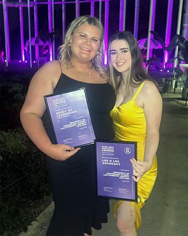 Georgina Hedge and Natasha Lloyd holding awards