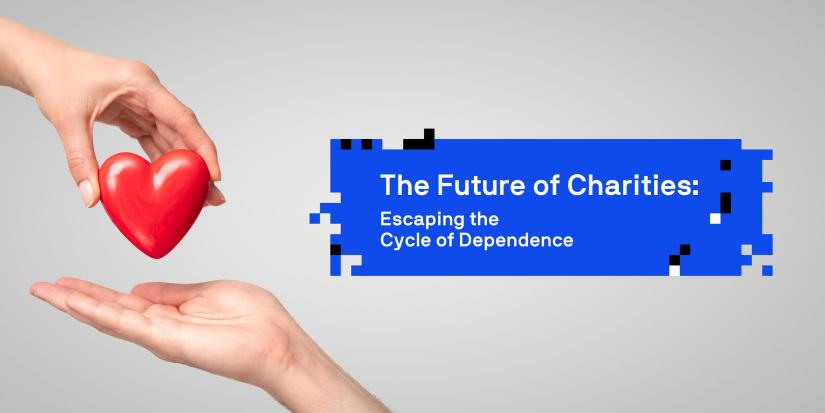 Hand holding a heart over an open palm in front of grey background. White text in blue box "The Future of Charities: Escaping the Cycle of Dependency"