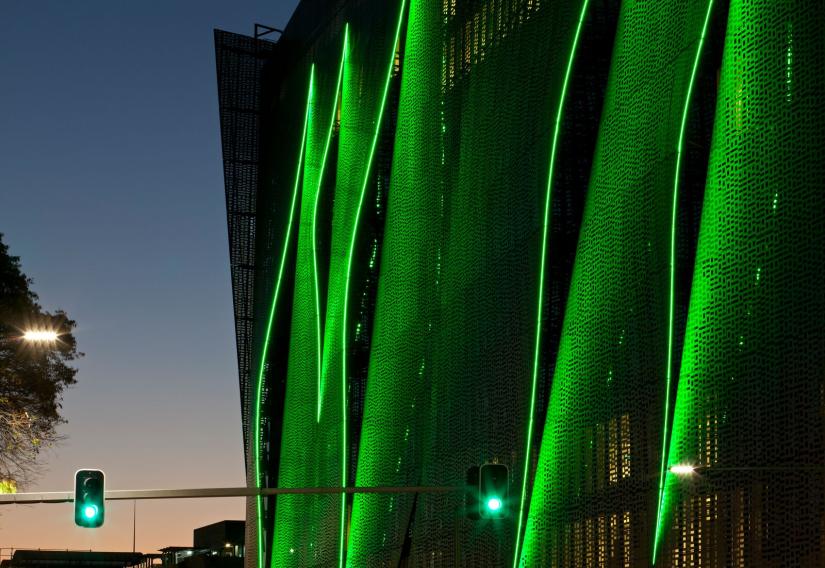 UTS Engineering and IT building lit up in green lights. 