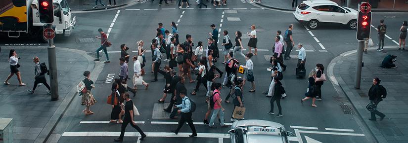 Stock picture of a group of people crossing a street in central sydney