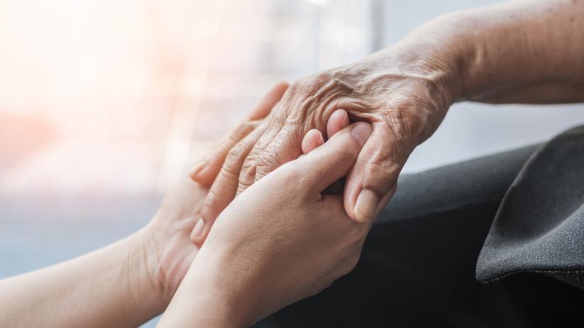 Two people holding hands