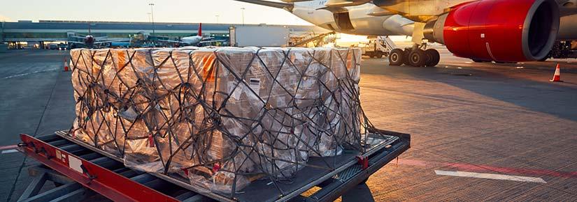 A slab of packages waiting on tarmak for aircraft loading