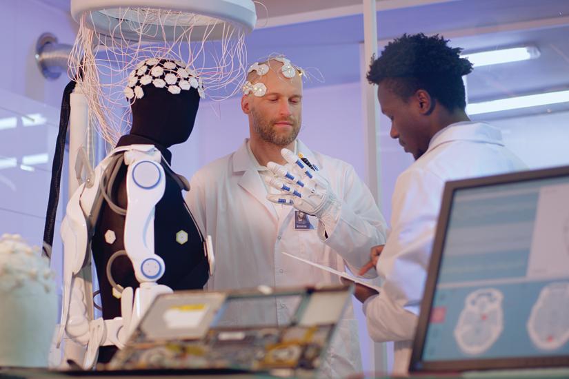 Robot with researchers in lab