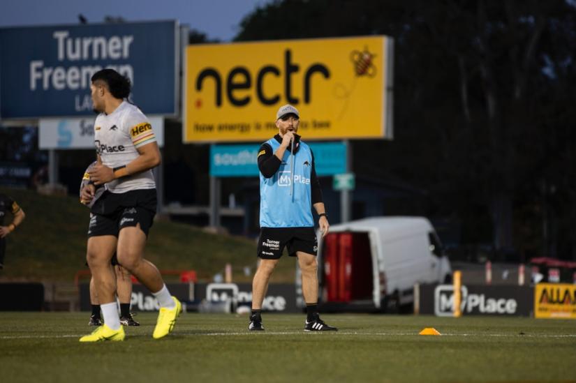 Tom Lovell assisting with training at the Penrith Panthers