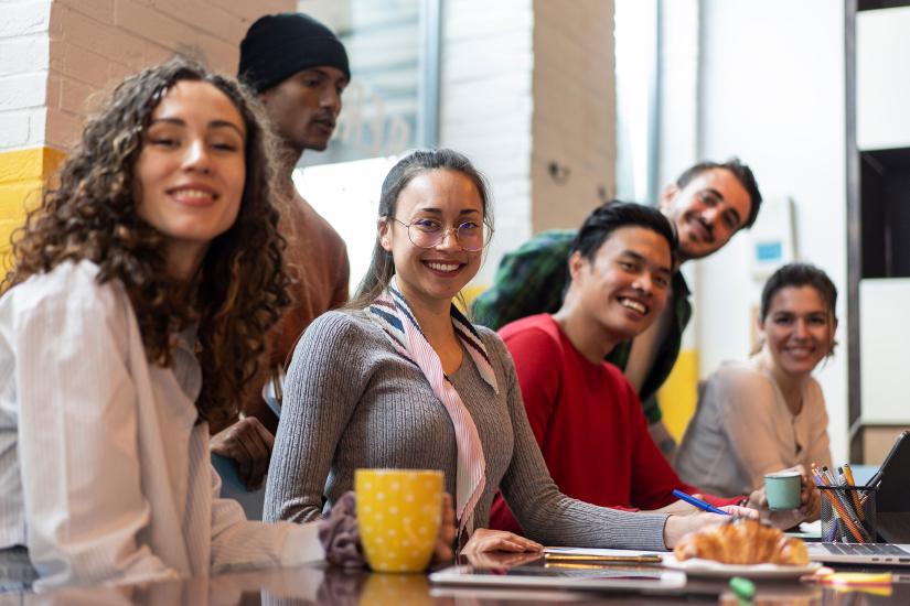 A stock picture of a smiling group of university age students working together. Picture: Adobe Stock