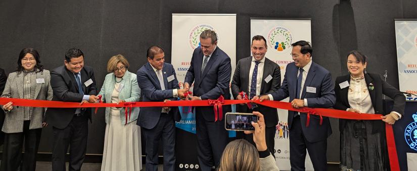 RCAA NSW chapter launch: group of people holding a ribbon, being cut at launch event