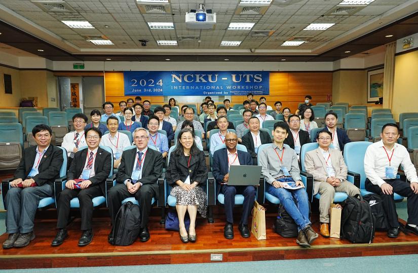 Researchers sitting in lecture room.