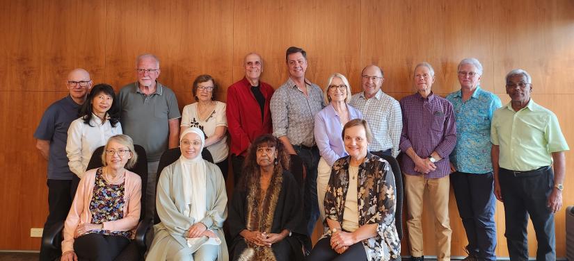 The IMPACCT Consumer Advisory Group members are in two rows - one row of people standing at the back the other sitting in front. 