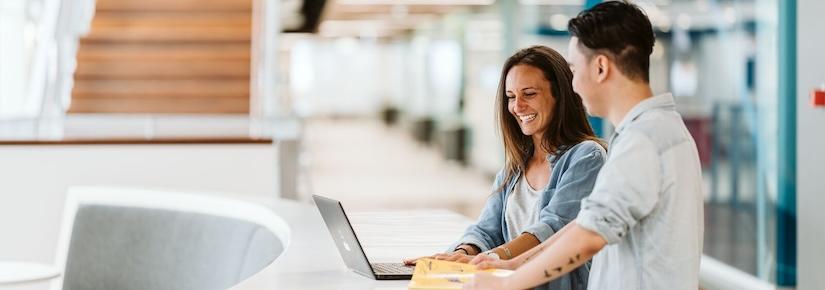 A UTS staff member helps a student with a webinar