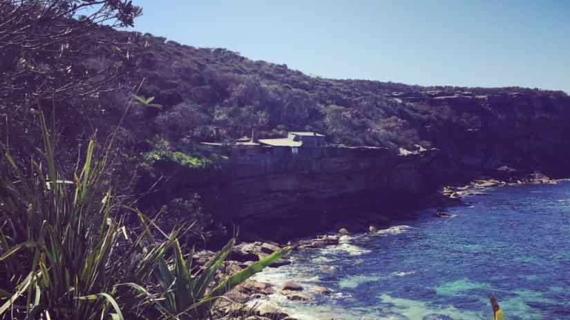 Shack perched on coastline