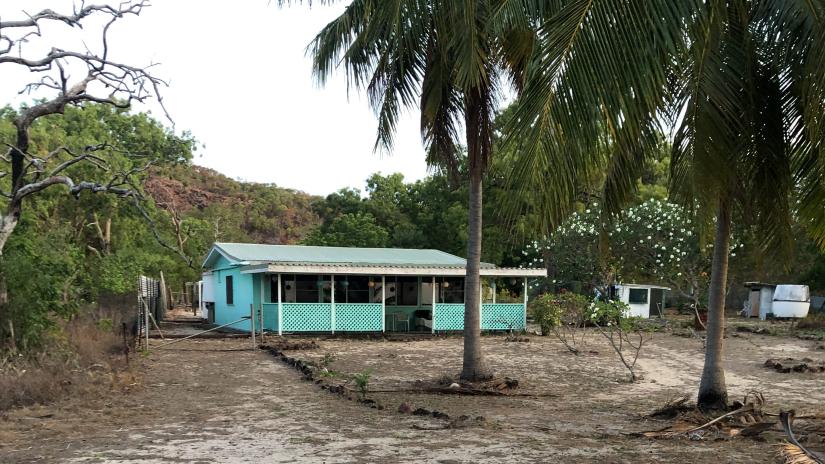 Freestanding beach shack surrounded by trees