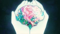 Animated still of hands holding a fluorescent puddle