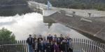 A group of people stand on the viewing platform overlooking Warragamba Dam
